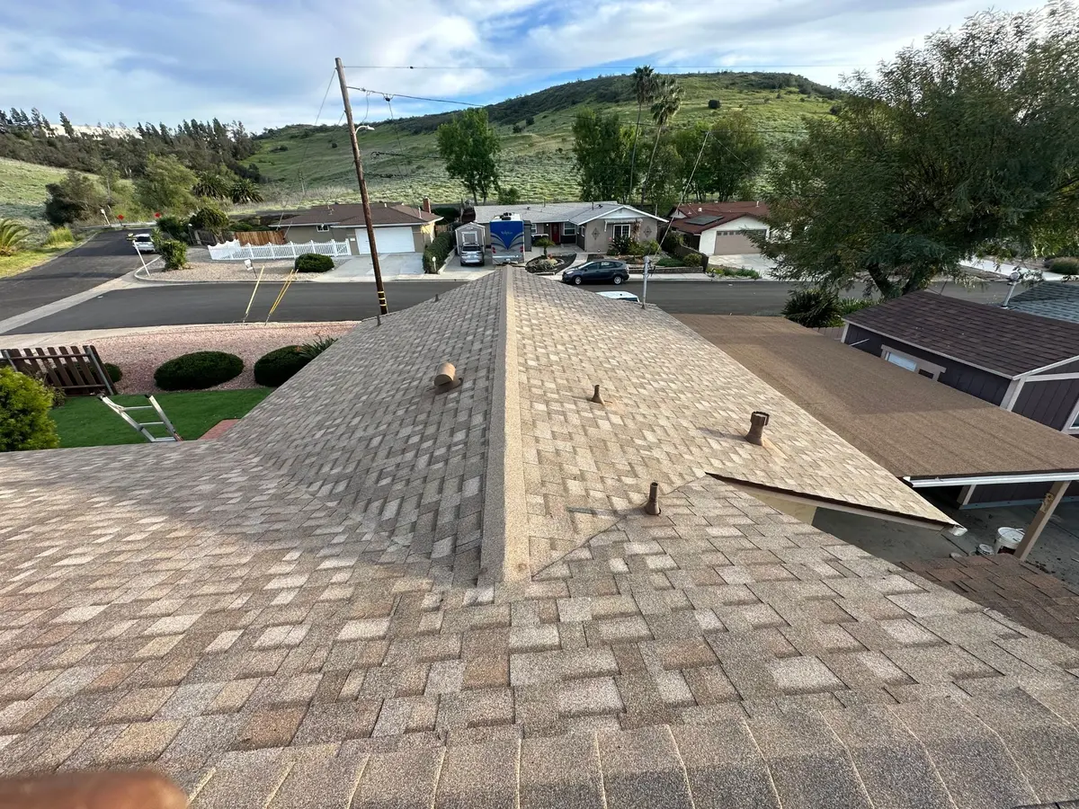 Completed architectural asphalt shingle roof installed by Zenith Roofing Services