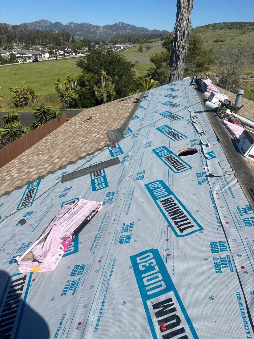 Titanium synthetic underlayment installed on a shingle roof deck