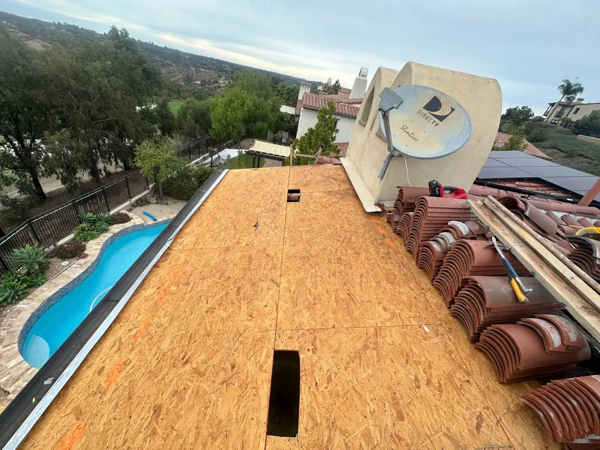 Two-piece clay tile staged during deck replacement