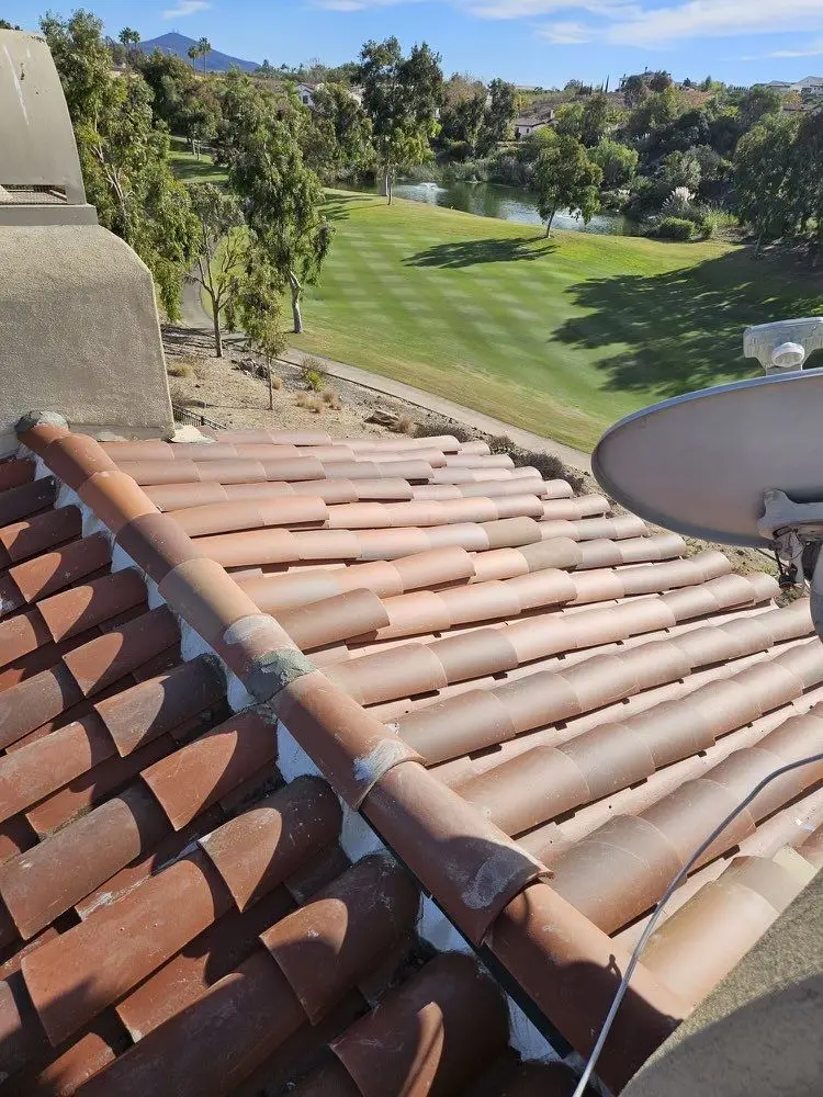 Two-piece clay pan and cover tile reinstalled after repair