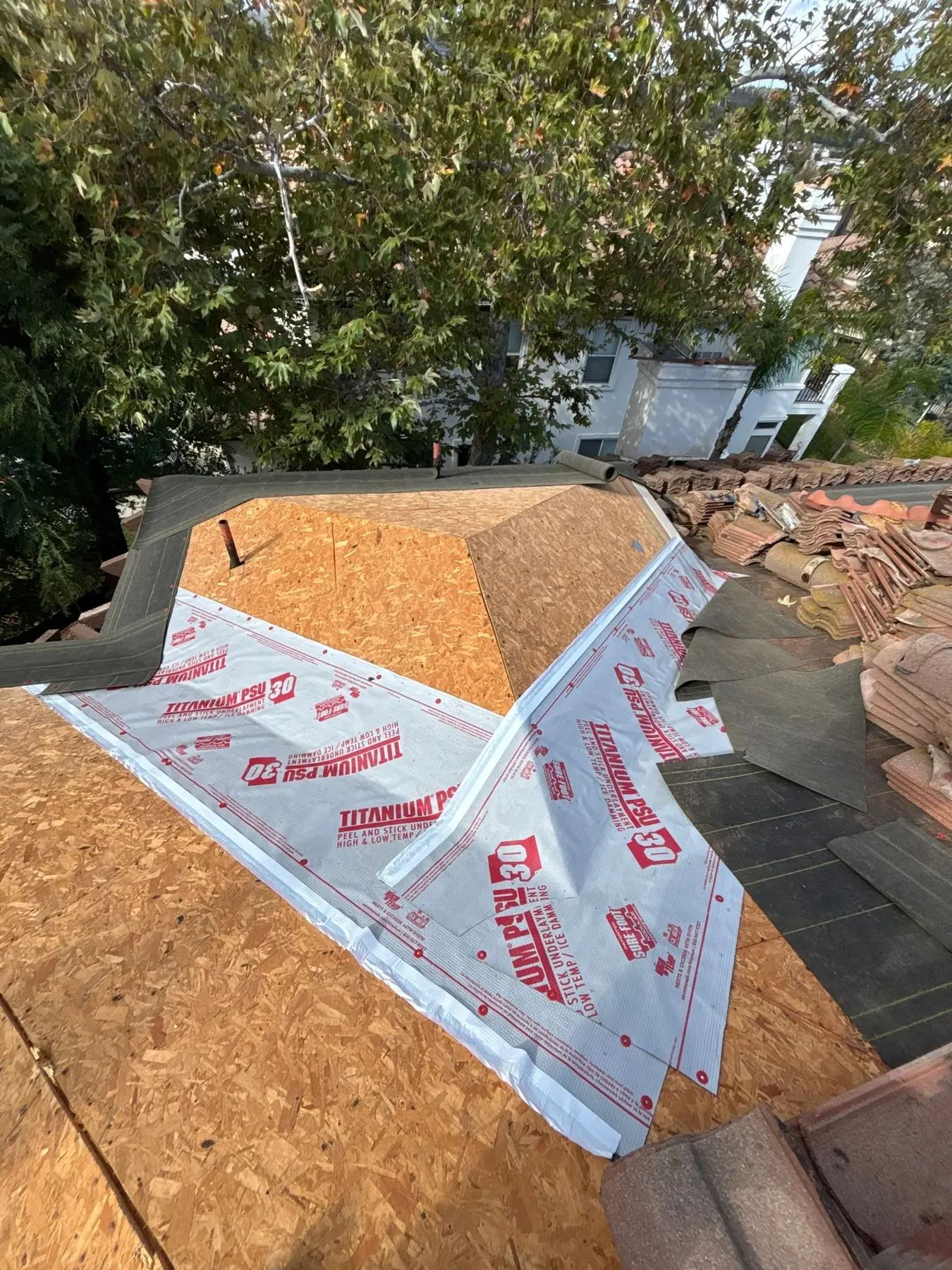 Peel and stick underlayment installed at a tile roof critical area