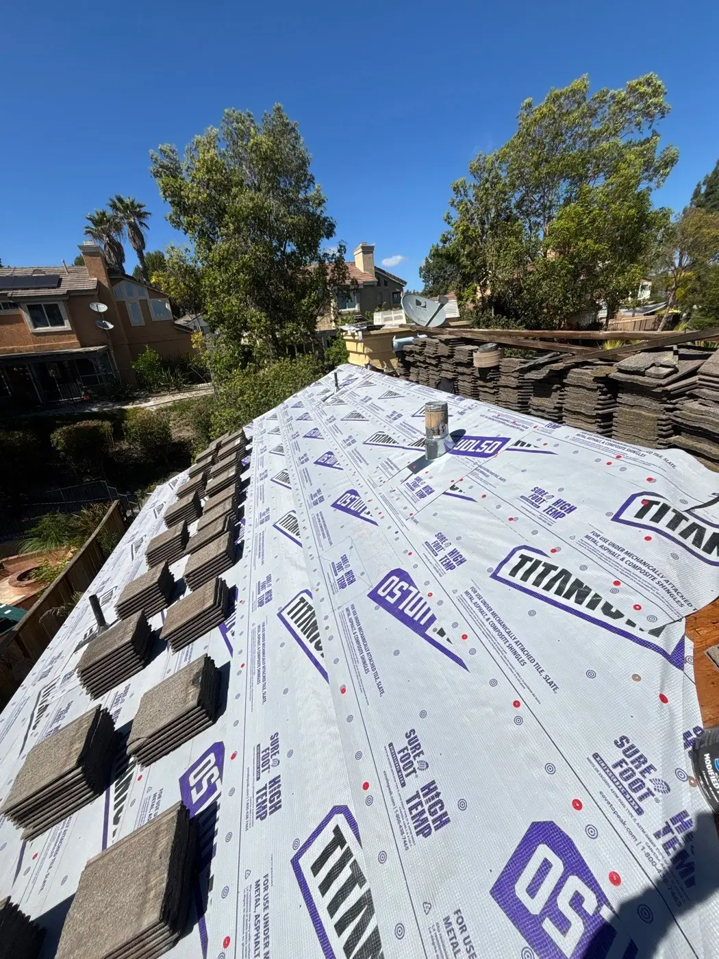 Titanium UDL50 synthetic underlayment installed beneath staged concrete roof tile