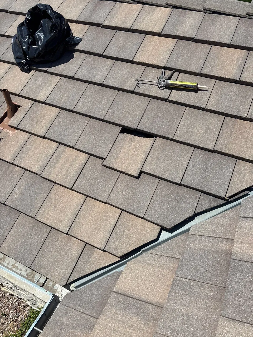 Concrete roof tiles being corrected during Murrieta roof maintenance