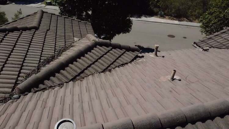 Debris collected in a tile roof valley