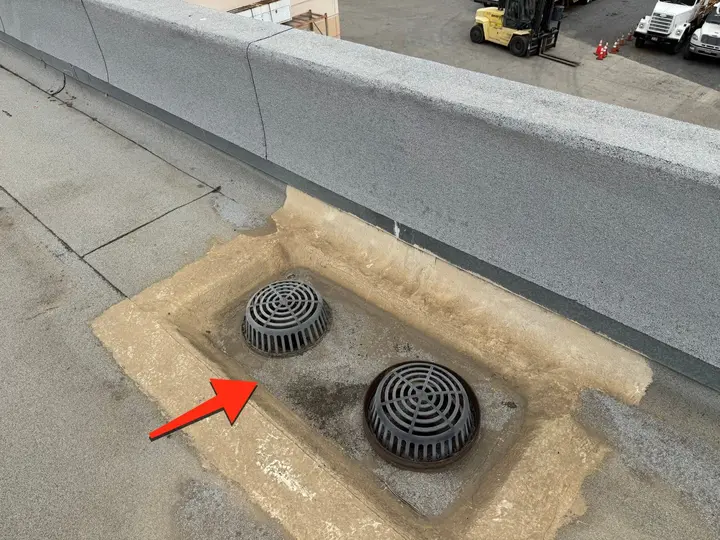 Commercial flat roof drains before tune-up maintenance and surface preparation