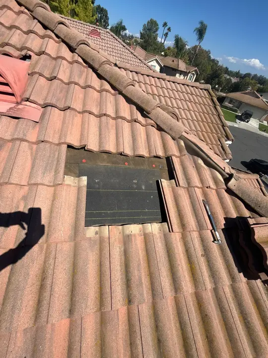 Localized underlayment repair beneath temporarily removed concrete roof tiles