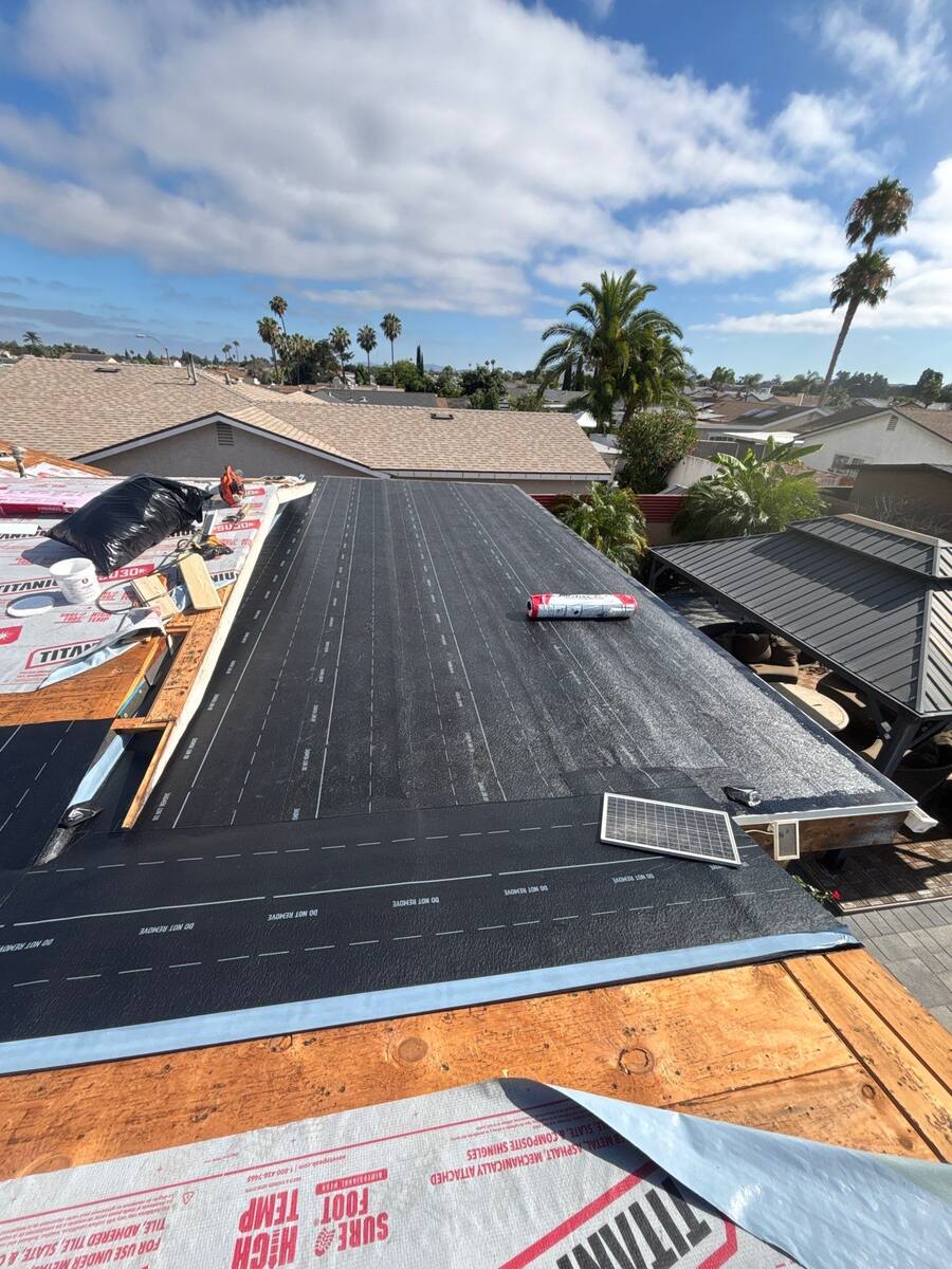 Progress view of self-adhered modified bitumen cap sheet