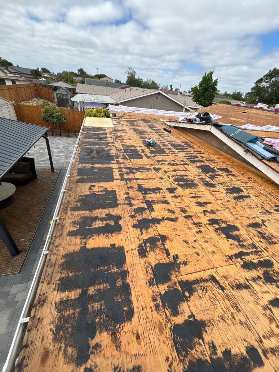Prepared plywood roof deck with old material removed