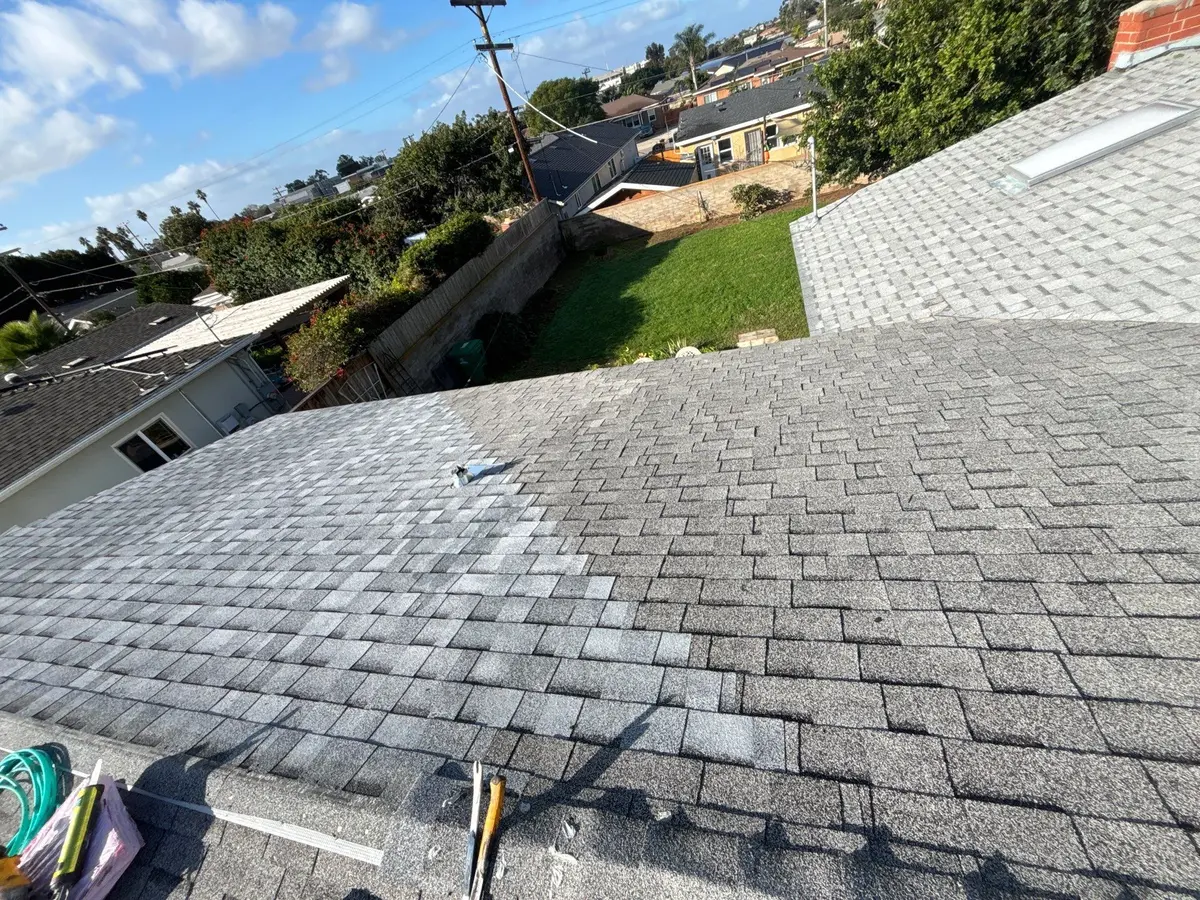 Sectional asphalt shingle roof repair extending from the eave to the ridge in San Diego