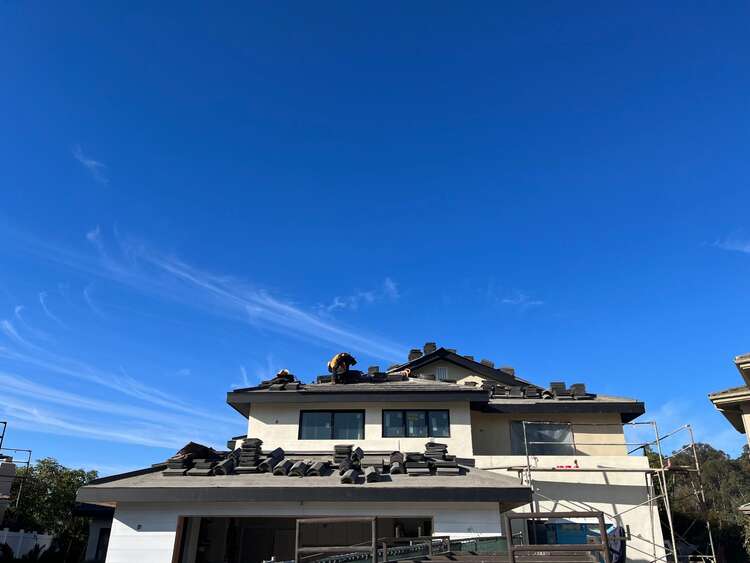 Zenith Roofing Services crew installing a new tile roofing system