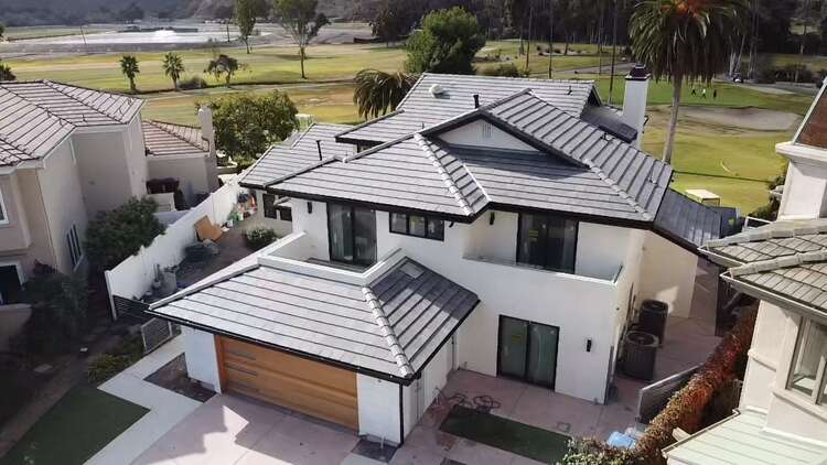 Completed grey tile roof replacement from above